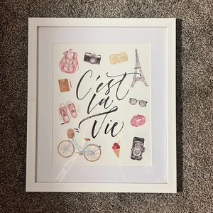 C’est La Vie hanging wall sign